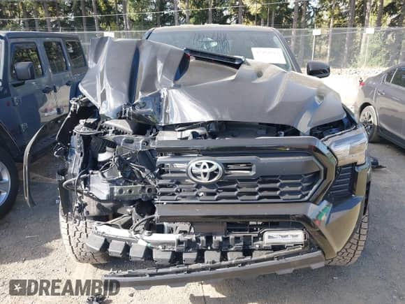 2024 Toyota Tacoma SR5 with VIN 3TMLB5JN4RM080833, listed as a IAAI auction lot 43404104 with 19,266 mi miles and . Bid and sale history available at DreamBid. Image 13.