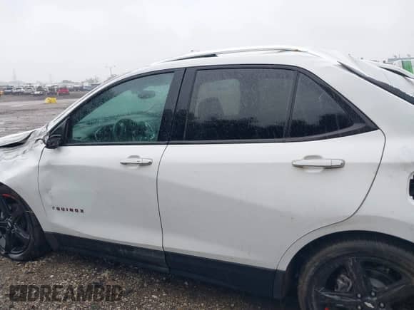 2021 Chevrolet Equinox Premier with VIN 2GNAXNEV0M6128650, listed as a IAAI auction lot 42361738 with 21,246 mi miles and . Bid and sale history available at DreamBid. Image 14.