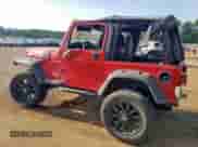 2000 Jeep Wrangler SE with VIN 1J4FA29P6YP703375, listed as a Copart auction lot 66914735 with 174,624 mi miles and Salvage title. Bid and sale history available at DreamBid. Image 2.
