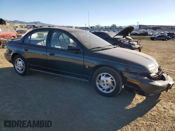 1996 Saturn SL with VIN 1G8ZK527XTZ335205, listed as a Copart auction lot 42230735 with 82,344 mi miles and Salvage title. Bid and sale history available at DreamBid. Image 4.