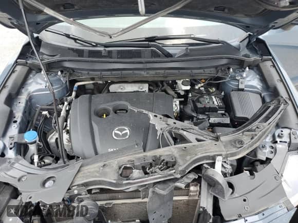 2022 Mazda CX-5 S Carbon Edition z VIN JM3KFBCM3N0576228, wystawiony jako Copart lot #63972945 z przebiegiem 63 644 mil mil oraz Nie do naprawy • Non repairable. Historia ofert i sprzedaży dostępna na DreamBid. Obrazek 12.