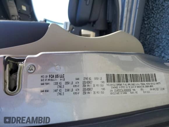 2018 Dodge Grand Caravan SXT with VIN 2C4RDGCGXJR282636, listed as a Copart auction lot 67184175 with 99,430 mi miles and Salvage title. Bid and sale history available at DreamBid. Image 13.