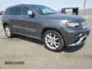 2014 Jeep Grand Cherokee Summit with VIN 1C4RJFJT6EC481846, listed as a Copart auction lot 71051545 with 216,706 mi miles and Salvage title. Bid and sale history available at DreamBid. Image 4.