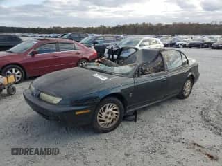 1999 Saturn SL with VIN 1G8ZJ5276XZ106206, listed as a Copart auction lot 75212184 with Not provided miles and Salvage title. Bid and sale history available at DreamBid. Image 1.