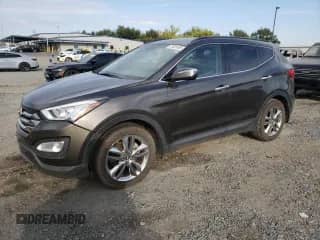 2014 Hyundai Santa Fe с VIN 5XYZUDLA6EG215861, выставлен на аукционе Copart как лот 81632495 с пробегом 99 576 миль миль и Списание • Salvage title. История ставок и продаж доступна на DreamBid. Изображение 1.