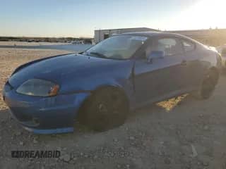 2005 Hyundai Tiburon GT с VIN KMHHN65F35U186438, выставлен на аукционе Copart как лот 41879955 с пробегом 152 574 миль миль и Списание • Salvage title. История ставок и продаж доступна на DreamBid. Изображение 1.
