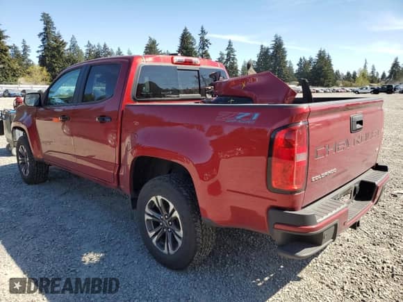 2021 Chevrolet Colorado 4WD Z71 with VIN 1GCGTDEN0M1259671, listed as a Copart auction lot 53388675 with 61,556 mi miles and Salvage title. Bid and sale history available at DreamBid. Image 2.