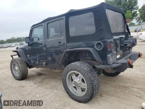 2007 Jeep Wrangler Unlimited Rubicon with VIN 1J4GA69117L112867, listed as a Copart auction lot 59909565 with 166,963 mi miles and Salvage title. Bid and sale history available at DreamBid. Image 2.