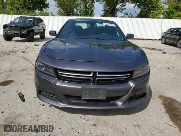 2015 Dodge Charger SE with VIN 2C3CDXFG1FH718048, listed as a Copart auction lot 65519185 with 129,379 mi miles and Salvage title. Bid and sale history available at DreamBid. Image 5.