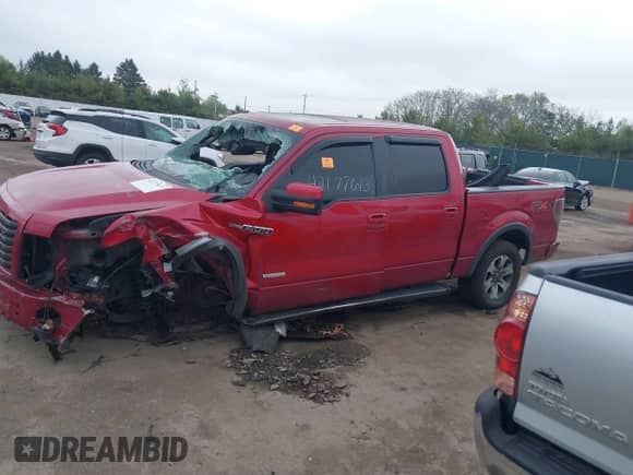 2011 Ford F-150 XLT z VIN 1FTFW1ET0BKE16588, wystawiony jako IAAI lot #42177613 z przebiegiem 162 954 mil mil oraz . Historia ofert i sprzedaży dostępna na DreamBid. Obrazek 13.