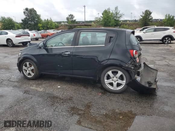 2012 Chevrolet Sonic LTZ with VIN 1G1JE6SH1C4132511, listed as a Copart auction lot 58445765 with 82,611 mi miles and Salvage title. Bid and sale history available at DreamBid. Image 2.