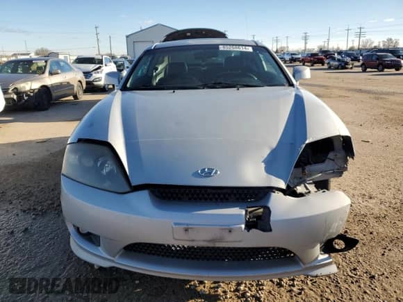 2006 Hyundai Tiburon GT с VIN KMHHN65F26U209337, выставлен на аукционе Copart как лот 85268614 с пробегом 110 955 миль миль и Списание • Salvage title. История ставок и продаж доступна на DreamBid. Изображение 5.