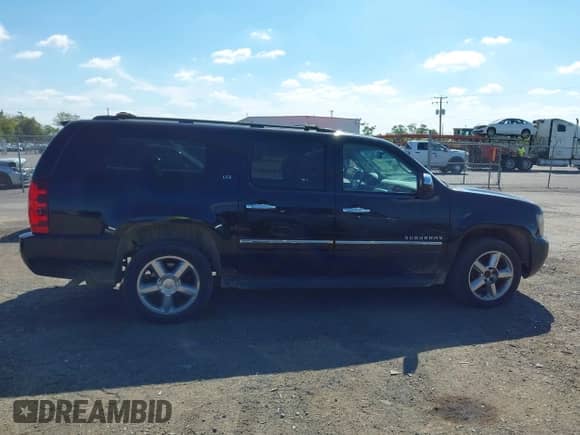 2011 Chevrolet Suburban LTZ with VIN 1GNSKKE3XBR233634, listed as a IAAI auction lot 43359509 with 240,336 mi miles and . Bid and sale history available at DreamBid. Image 13.