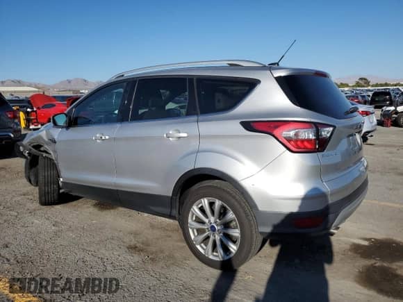 2017 Ford Escape Titanium с VIN 1FMCU0J97HUC56490, выставлен на аукционе Copart как лот 82139255 с пробегом 102 859 миль миль и Списание • Salvage title. История ставок и продаж доступна на DreamBid. Изображение 2.