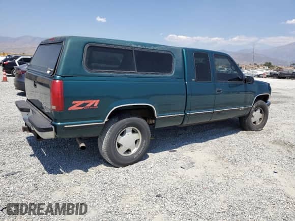 1998 Chevrolet Silverado 1500 z VIN 2GCEK19R0W1158312, wystawiony jako Copart lot #68561985 z przebiegiem 196 500 mil mil oraz Szkoda całkowita • Salvage title. Historia ofert i sprzedaży dostępna na DreamBid. Obrazek 3.