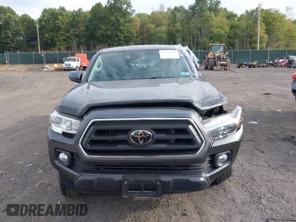2021 Toyota Tacoma SR with VIN 3TMCZ5AN7MM383352, listed as a IAAI auction lot 43246296 with 44,937 mi miles and . Bid and sale history available at DreamBid. Image 12.