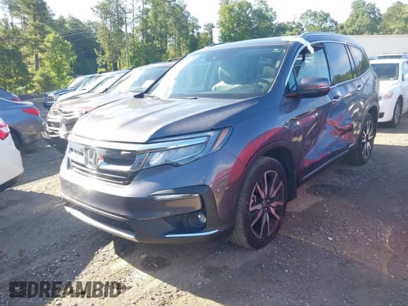 2022 Honda Pilot Touring 7-Passenger z VIN 5FNYF5H65NB001015, wystawiony jako IAAI lot #42523024 z przebiegiem 86 584 mil mil oraz . Historia ofert i sprzedaży dostępna na DreamBid. Obrazek 2.