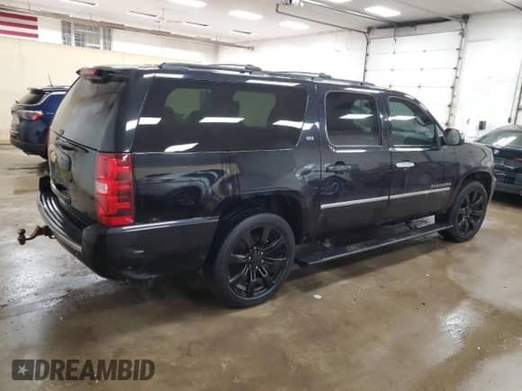 2013 Chevrolet Suburban LTZ с VIN 1GNSKKE75DR157293, выставлен на аукционе Copart как лот 47184115 с пробегом 168 208 миль миль и Чистый • Clean title. История ставок и продаж доступна на DreamBid. Изображение 3.