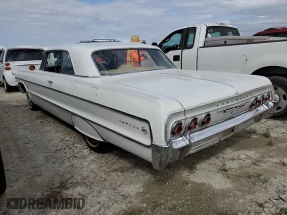 1964 Chevrolet Impala с VIN 41847J219664, выставлен на аукционе Copart как лот 75891214 с пробегом 47 312 миль миль и Списание • Salvage title. История ставок и продаж доступна на DreamBid. Изображение 2.