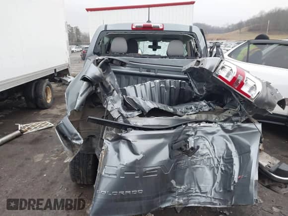 2021 Chevrolet Colorado 4WD Work Truck z VIN 1GCGTBEN9M1296691, wystawiony jako IAAI lot #41460241 z przebiegiem 55 952 mil mil oraz . Historia ofert i sprzedaży dostępna na DreamBid. Obrazek 17.