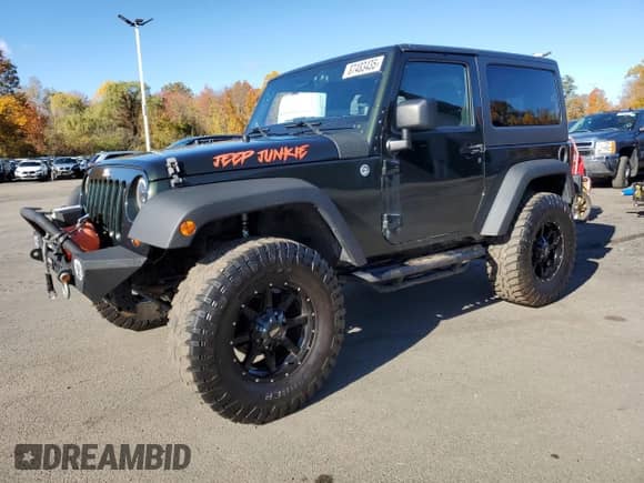2012 Jeep Wrangler Sport with VIN 1C4AJWAG5CL113509, listed as a Copart auction lot 87483435 with 173,046 mi miles and Clean title. Bid and sale history available at DreamBid. Image 1.