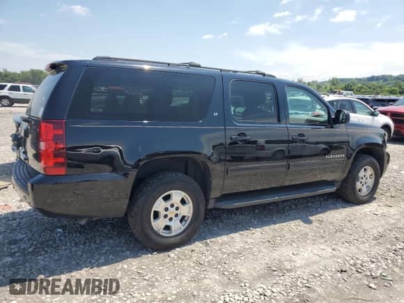 2013 Chevrolet Suburban LT with VIN 1GNSKJE70DR222223, listed as a Copart auction lot 64103285 with 216,118 mi miles and Clean title. Bid and sale history available at DreamBid. Image 3.