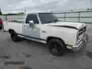 1986 Dodge Trucks with VIN 1B7HD14T1GS028485, listed as a Copart auction lot 67293695 with 43,907 mi miles and Salvage title. Bid and sale history available at DreamBid. Image 4.