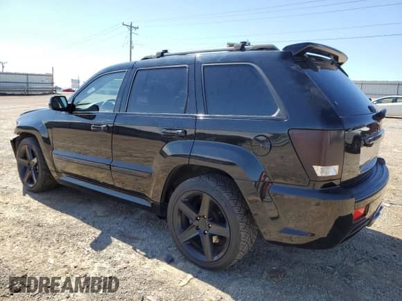 2008 Jeep Grand Cherokee SRT-8 with VIN 1J8HR783X8C157165, listed as a Copart auction lot 49428335 with 134,507 mi miles and Salvage title. Bid and sale history available at DreamBid. Image 2.