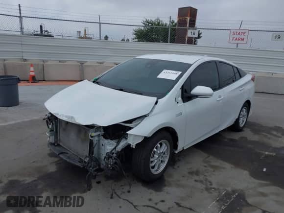 2021 Toyota Prius XLE with VIN JTDKAMFP6M3194992, listed as a IAAI auction lot 43311948 with 96,751 mi miles and . Bid and sale history available at DreamBid. Image 2.