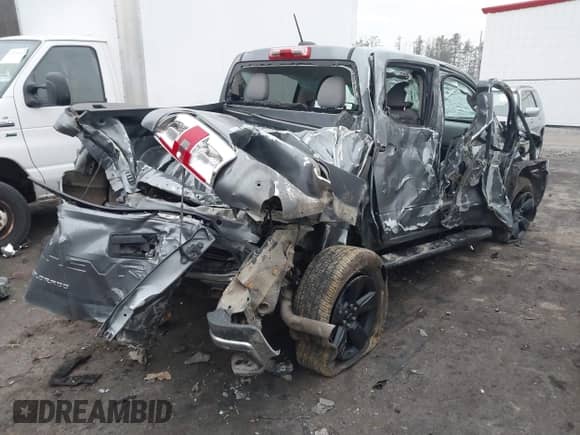 2021 Chevrolet Colorado 4WD Work Truck z VIN 1GCGTBEN9M1296691, wystawiony jako IAAI lot #41460241 z przebiegiem 55 952 mil mil oraz . Historia ofert i sprzedaży dostępna na DreamBid. Obrazek 4.