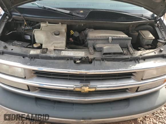 1999 Chevrolet Express z VIN 1GBFG15R6X1064605, wystawiony jako Copart lot #82674014 z przebiegiem 289 285 mil mil oraz Czysty tytuł • Clean title. Historia ofert i sprzedaży dostępna na DreamBid. Obrazek 11.