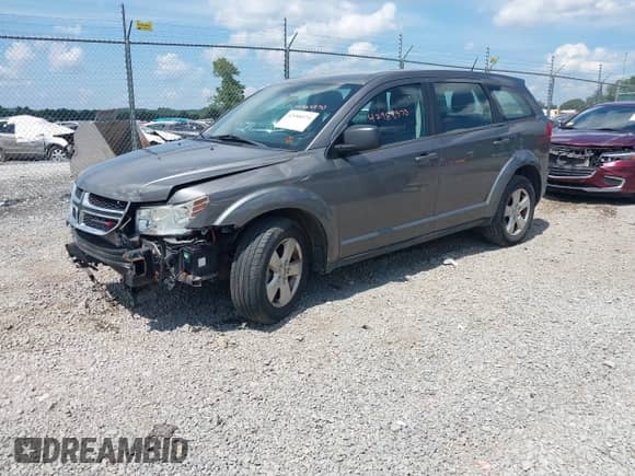 2013 Dodge Journey American Value z VIN 3C4PDCAB2DT560776, wystawiony jako IAAI lot #42988970 z przebiegiem 126 698 mil mil oraz . Historia ofert i sprzedaży dostępna na DreamBid. Obrazek 2.