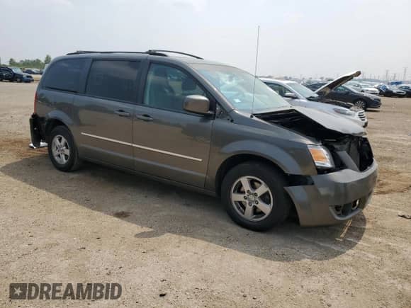 2010 Dodge Grand Caravan SXT с VIN 2D4RN5D11AR269031, выставлен на аукционе Copart как лот 67026245 с пробегом 142 710 миль миль и Списание • Salvage title. История ставок и продаж доступна на DreamBid. Изображение 4.