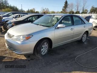 2002 Toyota Camry XLE with VIN JTDBF32KX20054853, listed as a Copart auction lot 84247555 with 176,850 mi miles and Clean title. Bid and sale history available at DreamBid. Image 1.