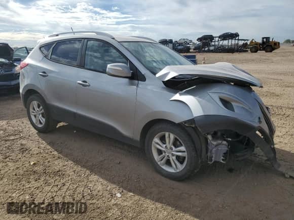 2012 Hyundai Tucson GLS with VIN KM8JUCACXCU429898, listed as a Copart auction lot 80696005 with 229,013 mi miles and Salvage title. Bid and sale history available at DreamBid. Image 4.