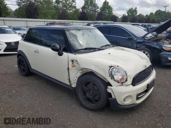 2013 MINI Hardtop with VIN WMWSU3C51DT374477, listed as a Copart auction lot 62654295 with 127,295 mi miles and Salvage title. Bid and sale history available at DreamBid. Image 4.