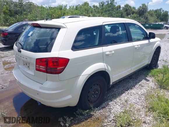 2012 Dodge Journey SE z VIN 3C4PDCABXCT255928, wystawiony jako IAAI lot #42536508 z przebiegiem 148 167 mil mil oraz . Historia ofert i sprzedaży dostępna na DreamBid. Obrazek 4.