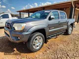 2012 Toyota Tacoma PreRunner with VIN 3TMJU4GN9CM129082, listed as a Copart auction lot 71174385 with 145,418 mi miles and Salvage title. Bid and sale history available at DreamBid. Image 1.