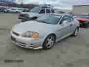 2003 Hyundai Tiburon GT с VIN KMHHN65F63U064962, выставлен на аукционе Copart как лот 44804045 с пробегом 186 171 миль миль и Списание • Salvage title. История ставок и продаж доступна на DreamBid. Изображение 1.