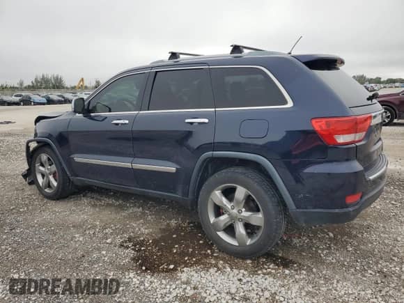2012 Jeep Grand Cherokee Overland with VIN 1C4RJECG5CC251450, listed as a Copart auction lot 70744305 with 122,000 mi miles and Salvage title. Bid and sale history available at DreamBid. Image 2.