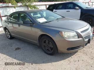 2010 Chevrolet Malibu 1LS with VIN 1G1ZB5EB8A4140602, listed as a IAAI auction lot 43513094 with 98,957 mi miles and . Bid and sale history available at DreamBid. Image 1.