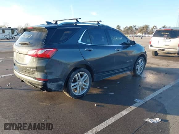2018 Chevrolet Equinox Premier with VIN 2GNAXWEX7J6139051, listed as a IAAI auction lot 41216437 with 105,453 mi miles and . Bid and sale history available at DreamBid. Image 4.