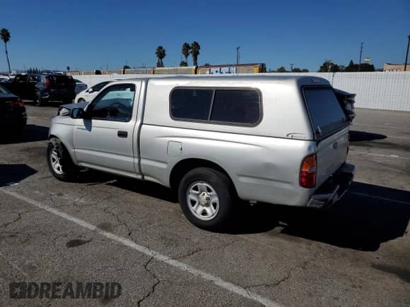 2001 Toyota Tacoma with VIN 5TENL42N61Z751733, listed as a Copart auction lot 82475265 with 283,177 mi miles and Salvage title. Bid and sale history available at DreamBid. Image 2.