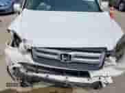 2006 Honda Pilot EX-L z VIN 5FNYF28656B039280, wystawiony jako Copart lot #70669555 z przebiegiem 232 655 mil mil oraz Szkoda całkowita • Salvage title. Historia ofert i sprzedaży dostępna na DreamBid. Obrazek 11.