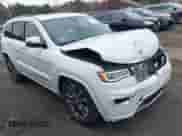 2018 Jeep Grand Cherokee Overland with VIN 1C4RJFCG2JC355512, listed as a IAAI auction lot 41999611 with 144,522 mi miles and . Bid and sale history available at DreamBid. Image 1.