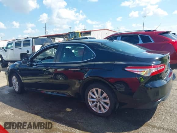 2020 Toyota Camry LE with VIN 4T1C11AKXLU877796, listed as a IAAI auction lot 43384594 with 78,546 mi miles and . Bid and sale history available at DreamBid. Image 14.