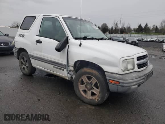2002 Chevrolet Tracker with VIN 2CNBE18CX26926779, listed as a Copart auction lot 86788864 with 172,966 mi miles and Salvage title. Bid and sale history available at DreamBid. Image 4.