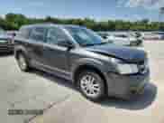 2016 Dodge Journey SXT with VIN 3C4PDCBG7GT145872, listed as a Copart auction lot 64283285 with 163,401 mi miles and Salvage title. Bid and sale history available at DreamBid. Image 4.