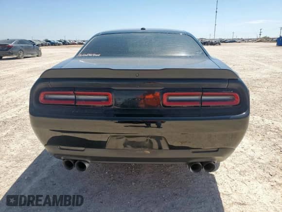 2021 Dodge Challenger SXT with VIN 2C3CDZAG7MH610596, listed as a Copart auction lot 66000985 with 63,220 mi miles and Salvage title. Bid and sale history available at DreamBid. Image 6.
