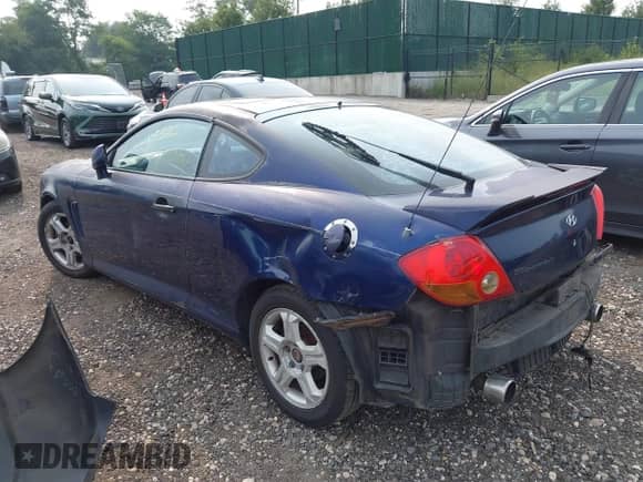 2003 Hyundai Tiburon with VIN KMHHM65D23U083655, listed as a IAAI auction lot 42923698 with Not provided miles and . Bid and sale history available at DreamBid. Image 3.
